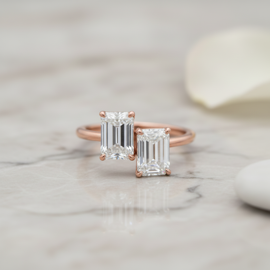 Emerald-cut diamond toi et moi ring with rose gold band