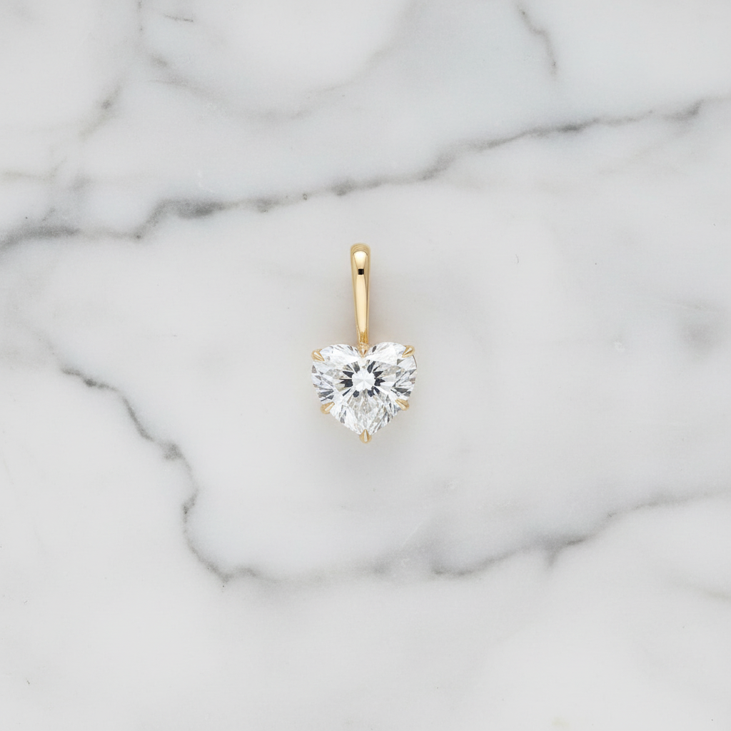 Heart diamond pendant on marble