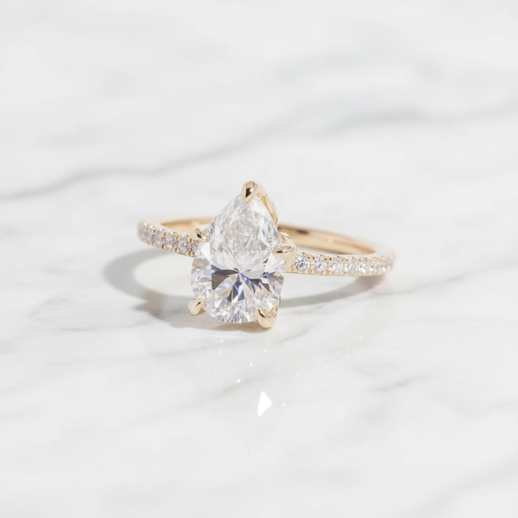 Pear-shaped diamond engagement ring with new background