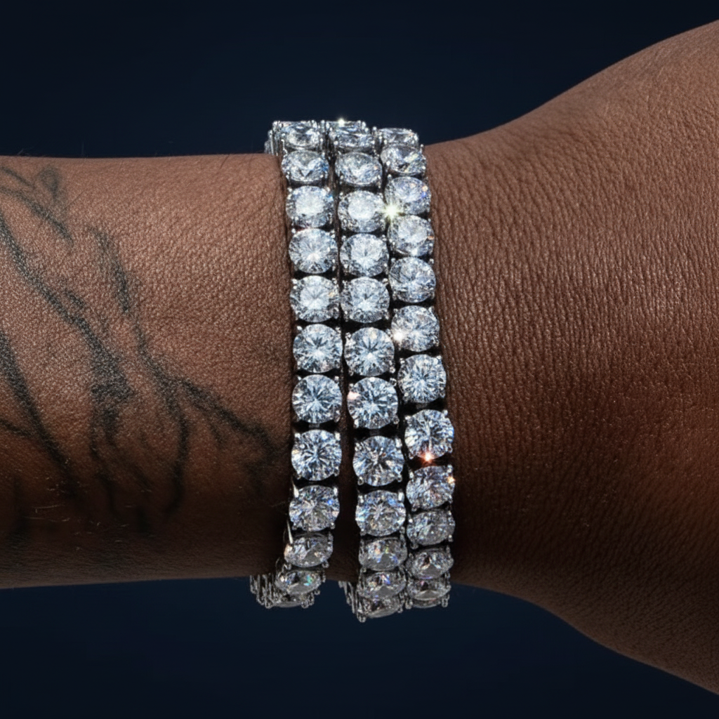 Stacked diamond tennis bracelets on wrist with tattoo