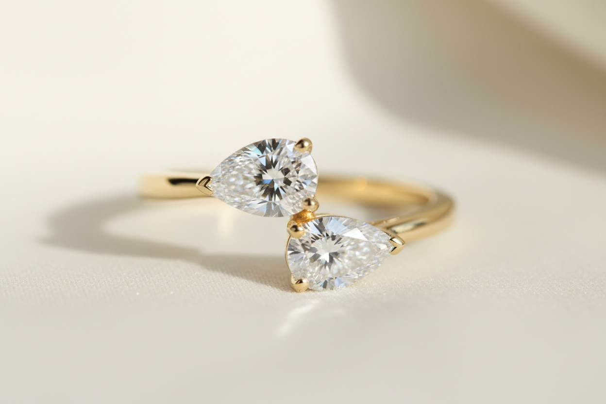 Two pear diamonds different sizes